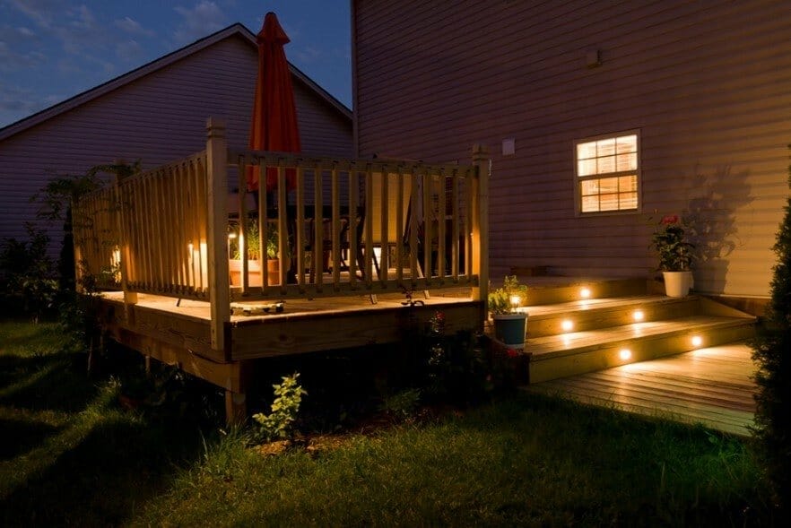 Garden lighting illuminates an outdoor decking area