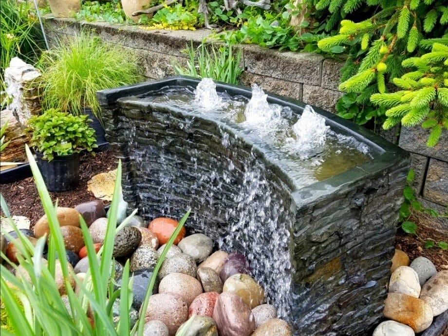 A water feature situated in a garden